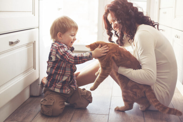 mother and baby with pet cat